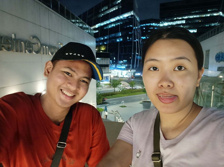 Rooftop skyline selfie under city night lights